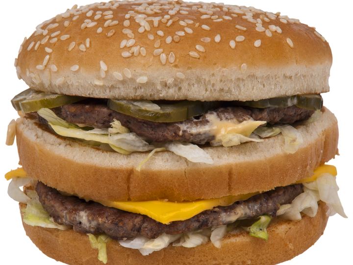 A Big Mac hamburger with three sesame bun layers